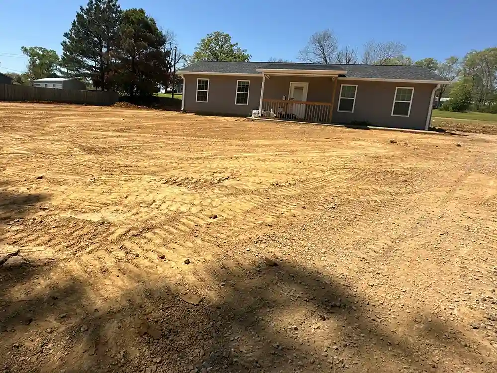 Gravel driveway installation before image